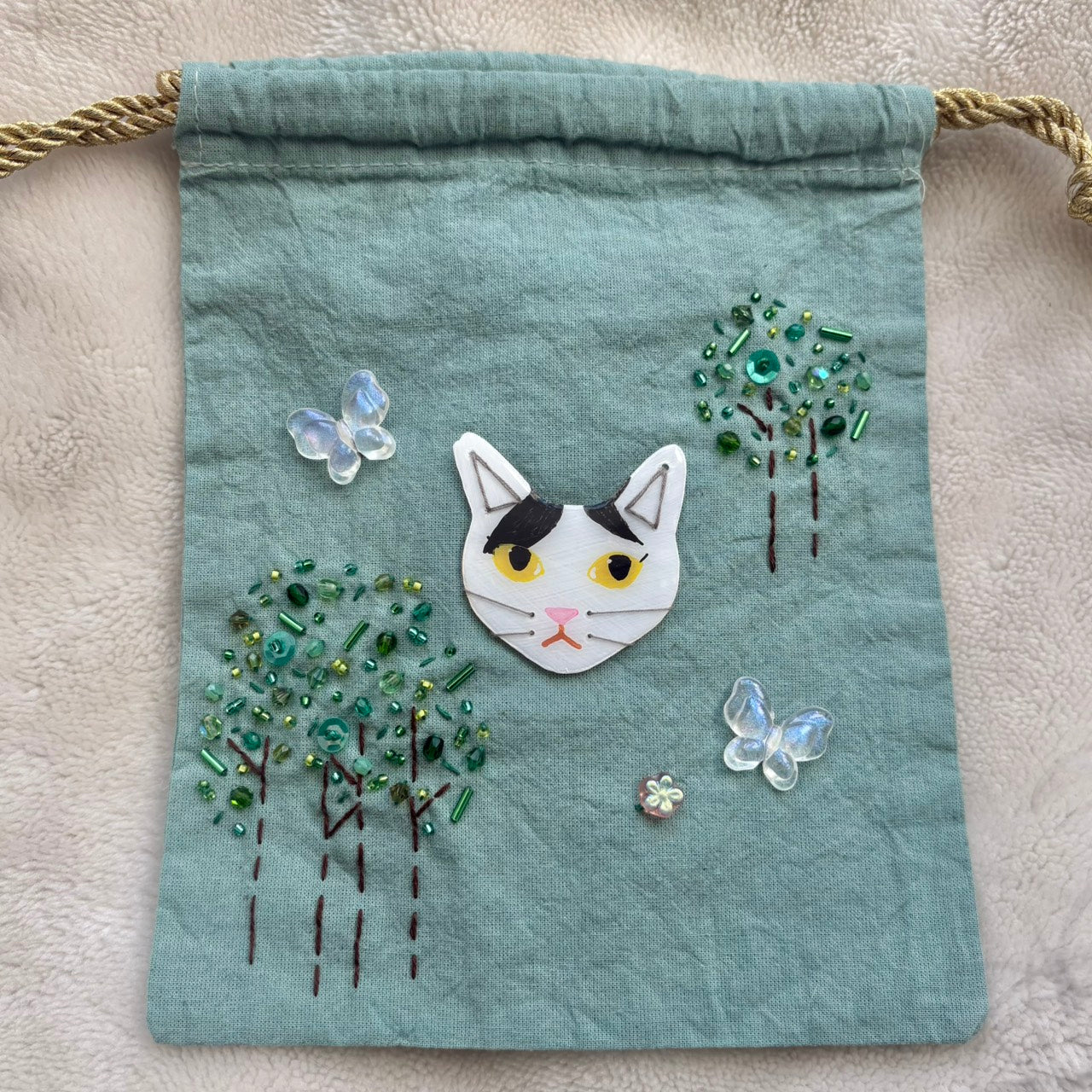 手染めのビーズ刺繍巾着 by yui