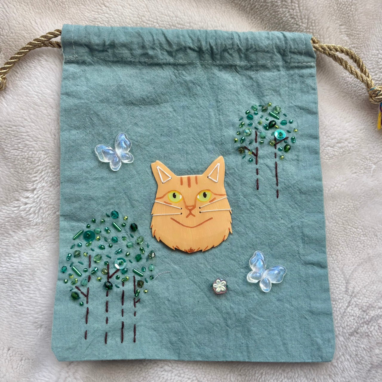 手染めのビーズ刺繍巾着 by yui