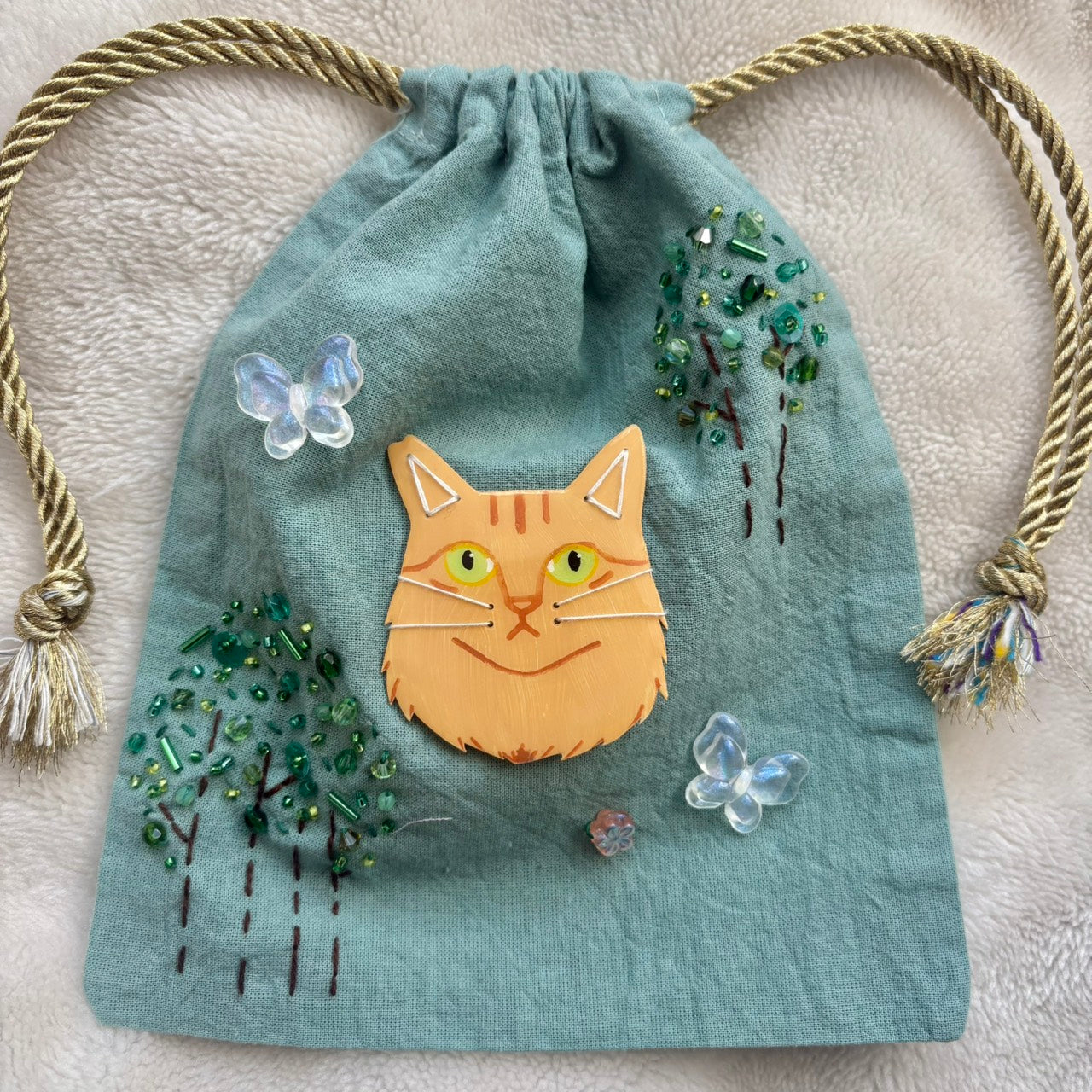 手染めのビーズ刺繍巾着 by yui