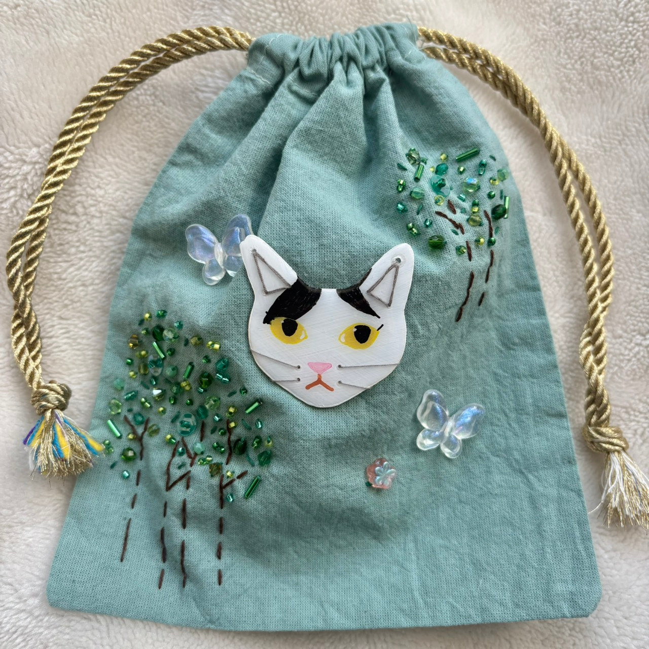 手染めのビーズ刺繍巾着 by yui